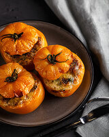 Yellow tomatoes stuffed with mushrooms and rice baked with mozzarella