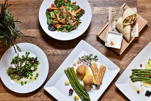 Various dishes with green and wild asparagus