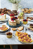 Various low carb cakes and baked goods on a buffet