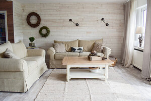 Bright, beige living room in country-house style