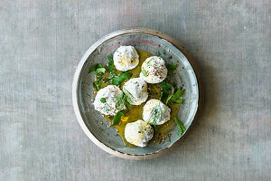 Herb labneh balls in olive oil