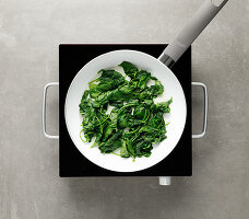 Spinach being steamed