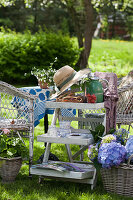 Shabby-chic side table in pleasant seating area in garden