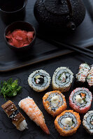 A selection of nigiri sushi and inside out rolls