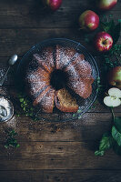 Apple wreath cake on a rustic wooden table