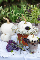 White pumpkins with a wreath of sea lavender and privet berries