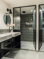 Bathroom for two with shower area and grey tiles