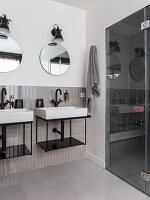 Bathroom for two with shower area and grey tiles