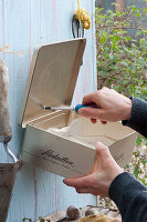 Tin can used for other purposes as a plant box and organizer