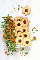 Flower-shaped biscuits with raspberry jam