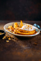 Flambé salted caramel bananas with peanut ice cream