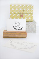 Postcard holder made from upcycled wood and two storage boxes with retro patterns