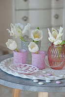 White tulips in candle lanterns