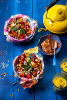 Chaat salad (spicy chickpea salad, India) with chutney and turmeric latte