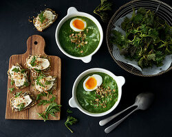 Green spinach soup with cooked eggs