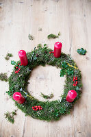 Handmade moss Advent wreath with red candles