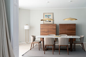 Marble-topped dining table, designer chairs and twin tallboys