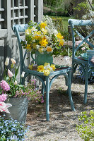 Bouquet of daffodils and bridal spars on chair at tea house