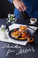 Waffles with fruits, whipped cream and maple syrup for Mother's Day