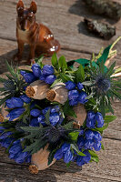 Closed Gentiana with Eryngo and poppy pods tied to a bouquet