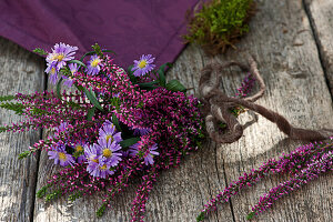 A small bouquet of budding heather and autumn aster