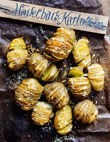 Hasselback potatoes with a wooden sign