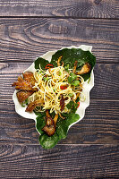 Kohlrabi and spaghetti salad with oyster mushrooms and chili peppers
