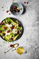 Salad with cherries and goats cheese