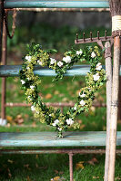 Heart of boxwood, hydrangea blossoms, and lady's mantle