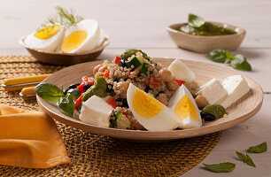 Quinoa salad with chickpeas, peppers, eggs and feta cheese