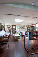 Eclectic salon with mahogany floor on a houseboat