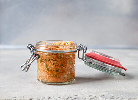 Homemade vegetable stock paste in a flip-top jar