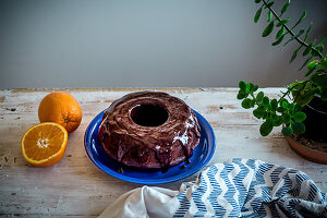Chocolate bundt cake with coconut sugar and orange chocolate glaze