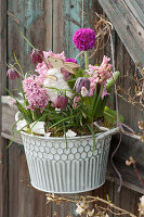 Pot with hyacinths, checkerboard flowers, globe primrose, and grape hyacinth with Easter bunny
