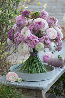 Standing bouquet with pastel-colored ranunculus