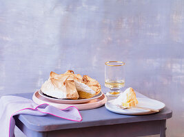 Lemon meringue pie, one slice on a plate