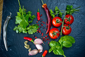 Chilli, garlic, coriander, tomatoes, basil, parsley, cardamon and pepper corns