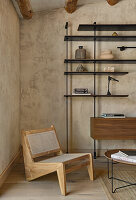 Designer chair and open shelf in the living room with sand colored wall