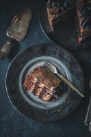 Chocolate cake decorated with blueberries, chocolate and cookies