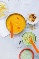 Cream of broccoli and cream of carrot soup