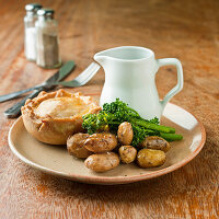 Pastry pie with broccoli and new potatoes