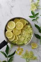 Preparing elderflower syrup