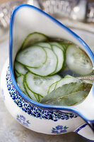 Cucumber salad in ceramic dishes