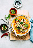 Pumpkin soup Asia style with coconut milk, ginger and rice noodles