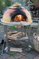 Preheating the pizza oven with wood