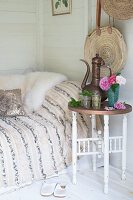 Daybed in summerhouse with vintage side table