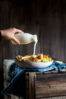 Hearty salad with chicken, bacon, and ranch dressing