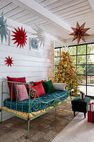 Christmas-decorated seating area with Christmas tree and stars