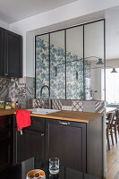 Kitchen cabinets with sink under an interior window