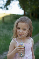 Girl with elderberry lemonade